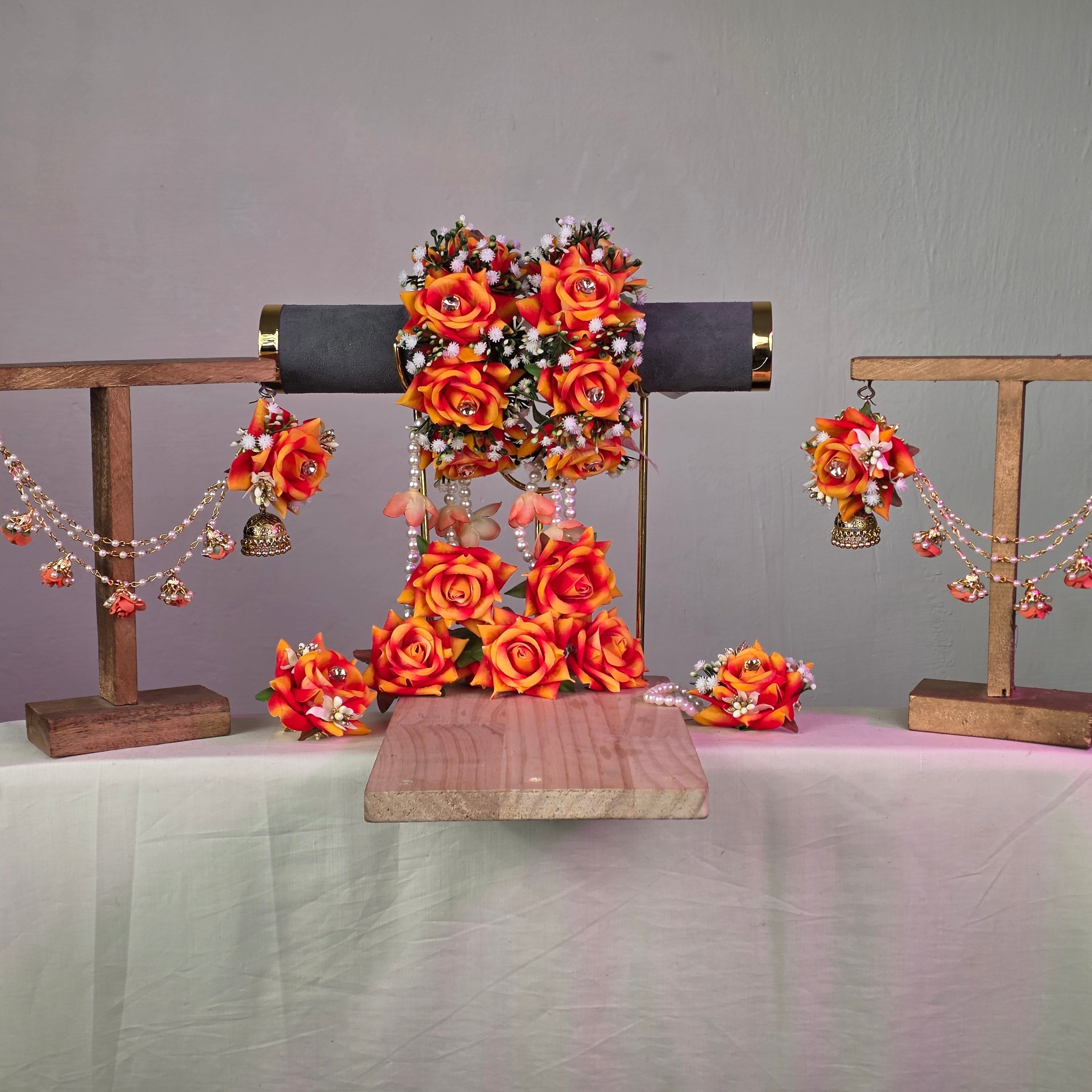 orange, rust colour artificial flower jewellery set for Pakistani weddings.