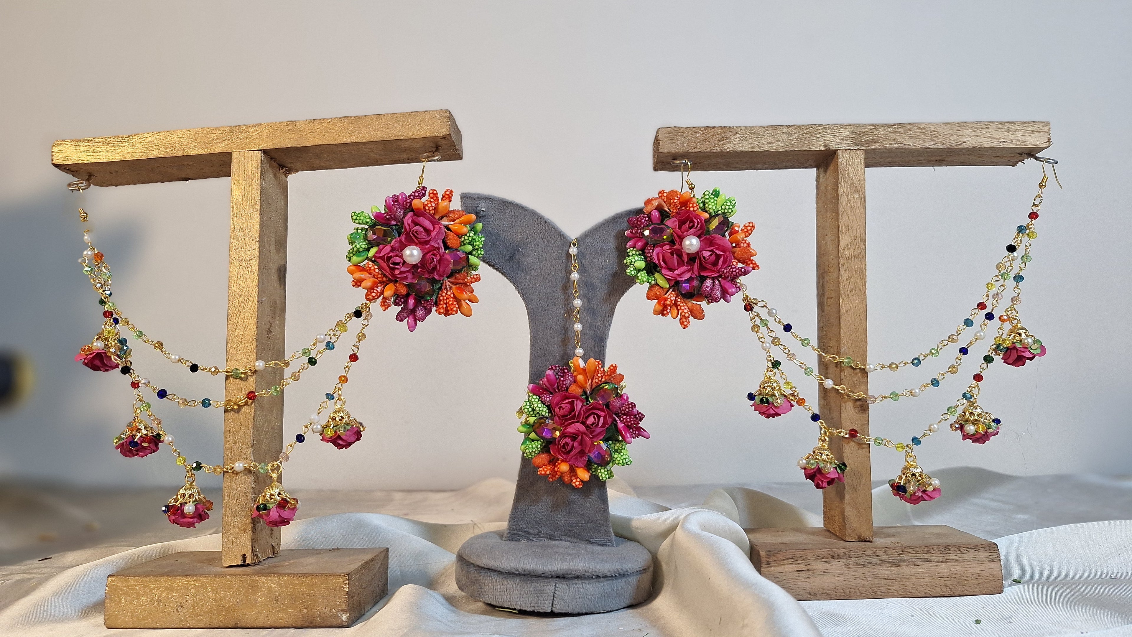 Colour Bloom bridal floral Jhumka Sahray earrings and matching Bindi set featuring vibrant multi-colored artificial flowers by De Fleuristes.