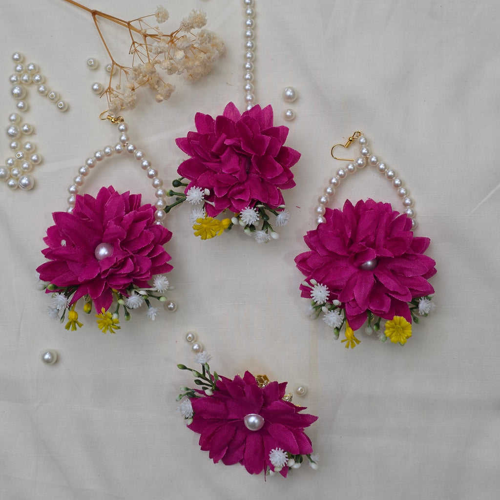 A bride wearing the Hot Pink Bliss floral jewelry set for a festive Mehndi celebration in Pakistan.